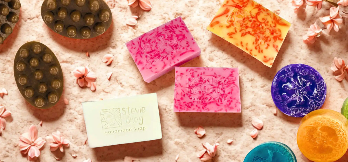 Assortment of colorful, decorative, and textured handmade soaps.