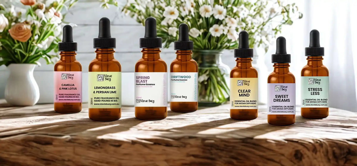 Seven amber glass dropper bottles of essential oil blends.